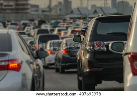 abstract blur of traffic jam with row of cars on expressway during rush hour Royalty-Free Stock Photo #407695978