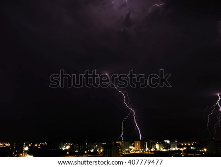 Thunder storm at night in the city 