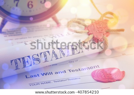 Vintage / retro style with bokeh : Rolled up scroll of last will and testament fastened with natural brown jute twine hemp rope, sealed with sealing wax and stamped / embossed with alphabet letter B.