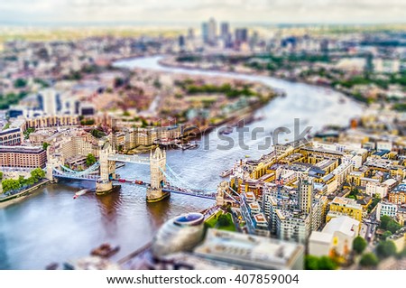 Panoramic View of London, over the river Thames towards Canary Wharf and Eastern London. Tilt-shift effect applied Royalty-Free Stock Photo #407859004