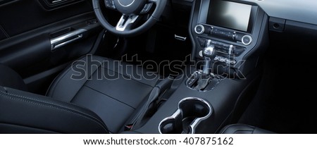 Leather upholstery inside the car interior  Royalty-Free Stock Photo #407875162
