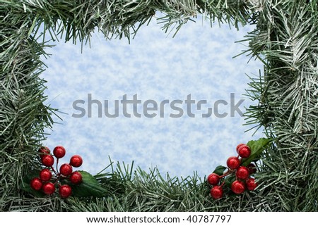 A green garland border on a snowflake background, garland border