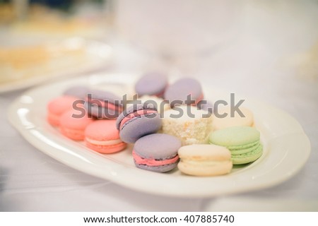 plate with colorful macaroon on table