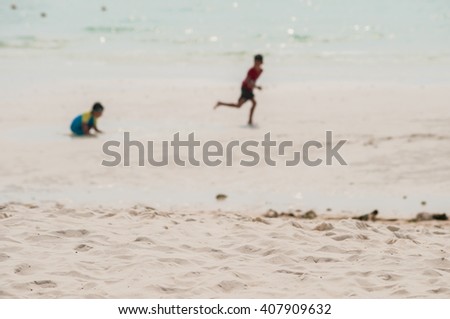 Blurred photo of peoples playing on the beach #7