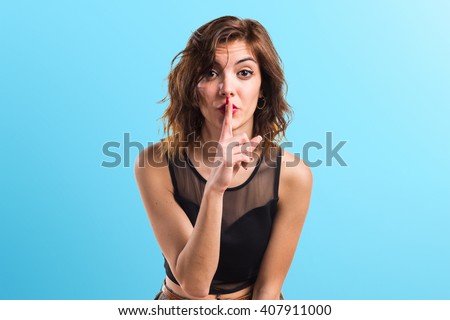 Pretty girl making silence gesture