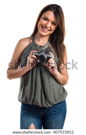 Young girl holding a camera