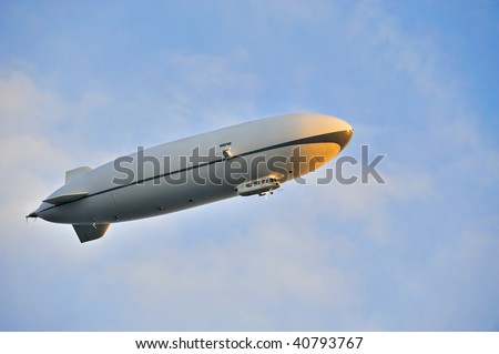 Zeppelin airship in the blue sky Royalty-Free Stock Photo #40793767