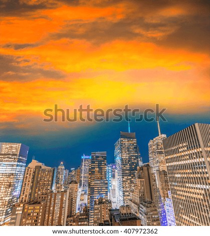 New York City at sunset. Amazing buildings from rooftop.