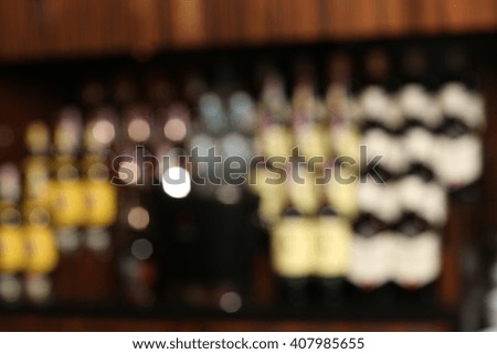 Blurred wine bottles background with luxury restaurant blur interior