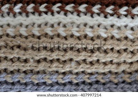 wool texture, horizontal white, brown, grey and black lines Royalty-Free Stock Photo #407997214