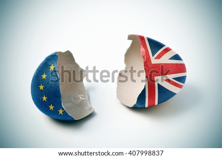 the two halves of a cracked eggshell, one patterned with the flag of the European Community and the other one patterned with the flag of the United Kingdom Royalty-Free Stock Photo #407998837