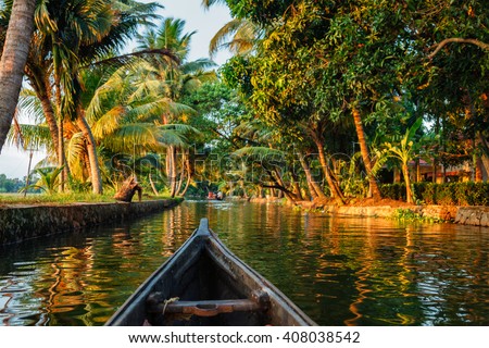 Kerala backwaters tourism travel in canoe boat. Kerala, India Royalty-Free Stock Photo #408038542