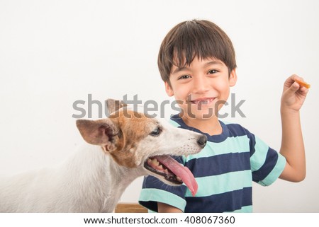 Little boy playing with his friend dog jack russel
