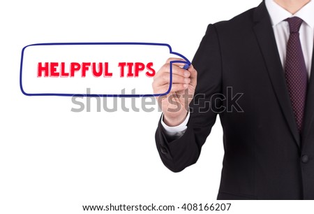 Hand writing a word HELPFUL TIPS on white board