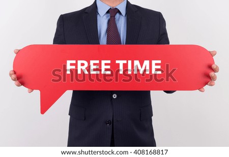 Businessman holding speech bubble with a word FREE TIME