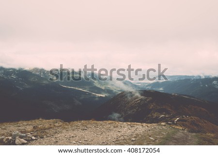 Tatra mountains in Slovakia covered with clouds. autumn colors. - vintage film retro effect