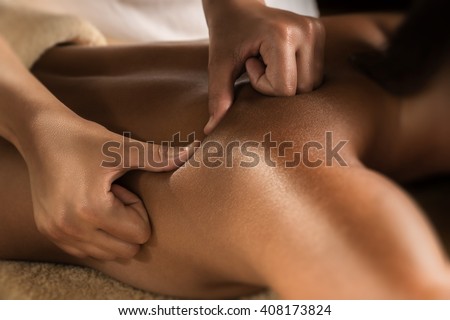 Deep tissue massage closeup view. Charming lighting Royalty-Free Stock Photo #408173824