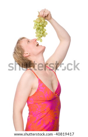 Full isolated studio picture from a young woman with some grapes