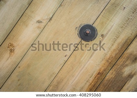 screw flat washer on wood texture background, selective focus