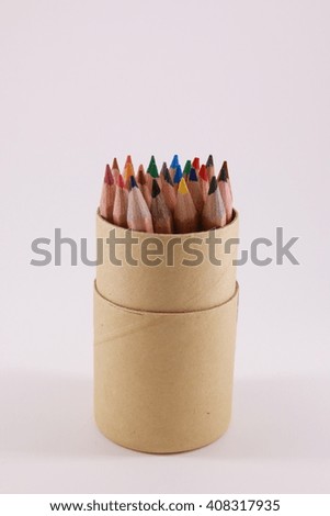  colored pencils in paper covered can