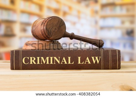 Criminal Law books with a judges gavel on desk in the library. Legal education concept.  Royalty-Free Stock Photo #408382054