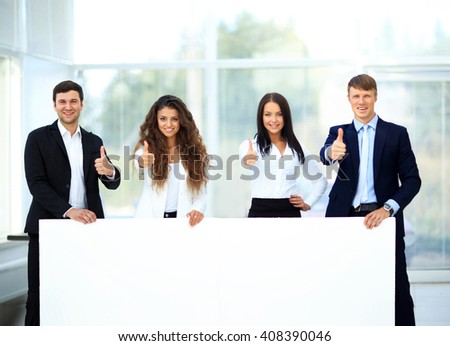 Business group with banner in office