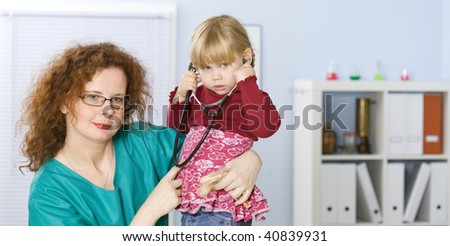 small young girl at doctor founding stethoscope