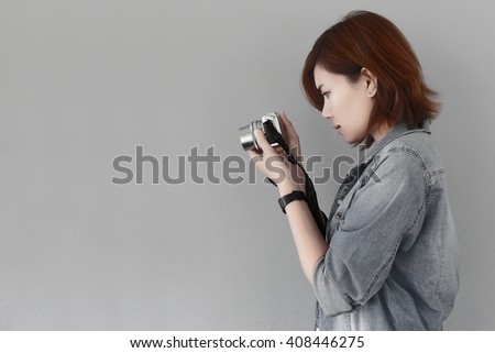 Photographer girl shooting images with copy space area, japan picture style