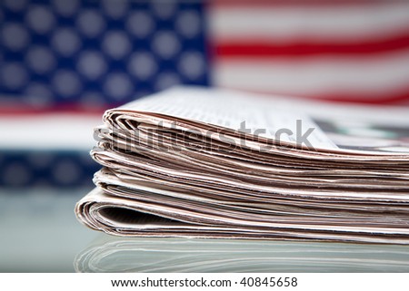 Newspapers before ensign of the USA