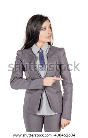portrait of a smiling business woman pointing finger showing copy space. human emotion expression and lifestyle concept. image on a white studio background.
