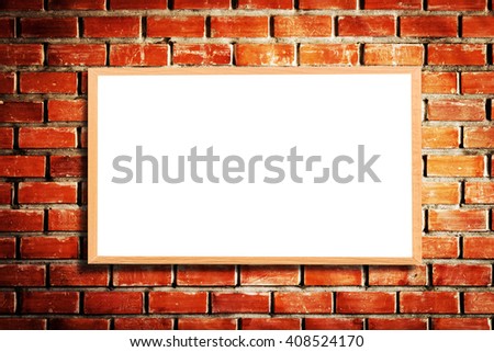 Mock up blank wooden picture frame on brick wall