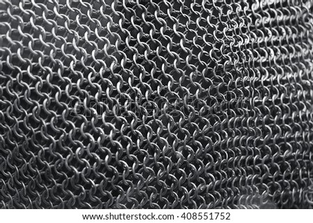 
Chain mail texture from durable metal. Royalty-Free Stock Photo #408551752