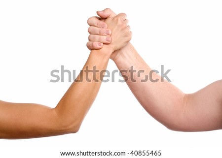 A man and woman with hands clasped arm wrestling.