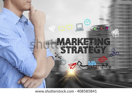 young man stand and thinking with MARKETING STRATEGY text ,business concept 