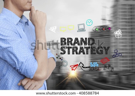 young man stand and thinking with BRAND STRATEGY   text ,business concept 