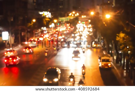 Blurred background. Night city lights blur. Toned photo