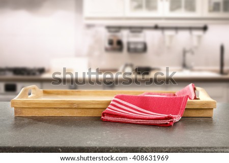 white retro blurred background of kitchen furniture and free space for your food and red napkin and kitchen desk 