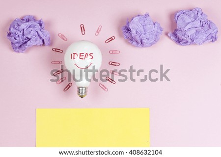 great idea concept with crumpled colorful paper and light bulb on light background. Creative brainstorm concept business idea.  Copy space for text.
