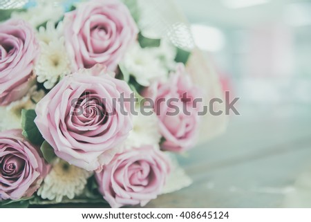 Wedding Bouquet with vintage filtered,  Flower bouquet of roses on wooden background, selective focus, Shallow depth of field