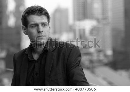 Black and white portrait of businessman outdoors