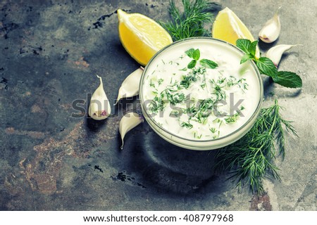 Tzatziki sauce. Fresh dip with yogurt, herbs dill and mint. Vintage style toned picture