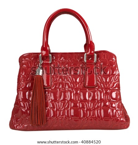 red patent handbag with a brush