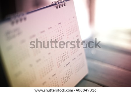 blurred calendar in dramatic tone. Royalty-Free Stock Photo #408849316
