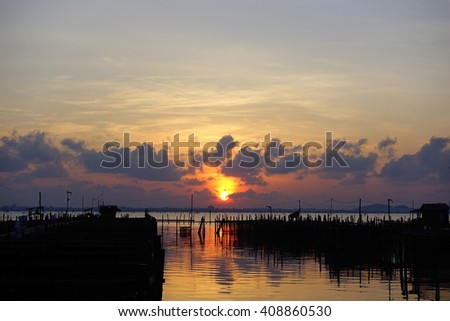 Silhouette image Lake view  in the morning with Sunrise background,Songkhla Lake Songkhla Southern Thailand:select focus with shallow depth of field:Ideal use for background.