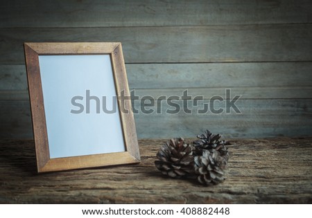 Frame on old table  wood still life
