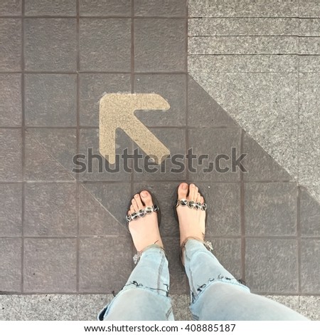 Woman's shoes with one arrow directions, concept great for any use.