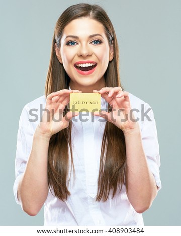 Advertising of payment systems with beautiful woman holding credit bank card. Isolated portrait of smiling  female model.