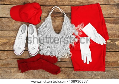 Santa Claus costume on wooden background, close up