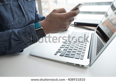 laptop and phone and watch