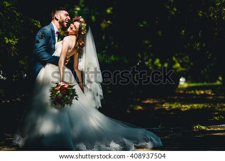 Creative young couple spends their happy wedding day Royalty-Free Stock Photo #408937504